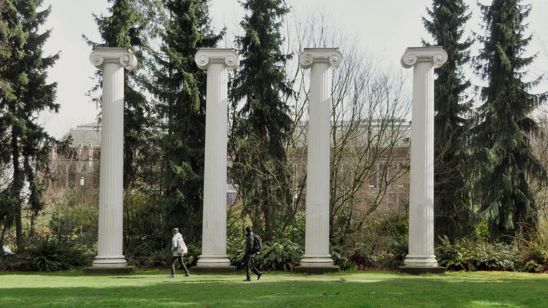 Five white classical columns standing in a row